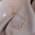 Close-up of rose gold zircon bracelet featuring a sliding adjuster on silky fabric - Rose Gold Micro-pave Round Bar Bracelet(9#)