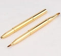 Dual-ended retractable gold lip brush with fine brown fibers and protective metal caps - Double Ended Lip Brush / Gold