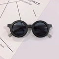 Detail view of round matte black children's frames with dark gray tinted lenses - Sand Black / Grey Lens