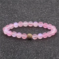 Pink matte moonstone beaded bracelet featuring a golden micro-pave zircon ball detail - Pink