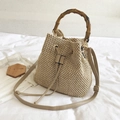Beige straw bucket bag with bamboo handles and adjustable shoulder strap for women - Khaki