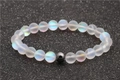 Moonstone and hematite beaded bracelet with aurora glass effect on dark textured surface - Phantom Color Moonstone Hematite