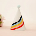 White party cone hat with rainbow stripes and a soft light blue pom pom on top - Rainbow Stripe Style