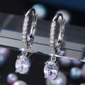 Elegant silver earrings with oval cubic zirconia drop and micro-pave setting - E720 Oval / Silver