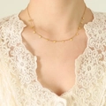 Elegante collana girocollo placcata oro 18 carati con delicati ciondoli a forma di cuore - Stile Cuore Oro