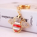 Sparkling crystal bee keychain with gold plating and red-white stripes for handbags - Red