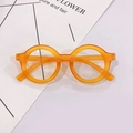 Macro detail of vibrant orange round children's glasses with matte frosted texture - Orange Frame Clear Lens