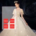 Luxuriöses schulterfreies Brautkleid in Champagner mit Silberpailletten und Stickereien - US 26W / Bodenlang