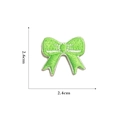 Macro detail of a 2.6cm mini green embroidered bow patch for DIY crafts and doll clothing - Self-adhesive Green Bow-16#