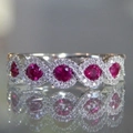 Elegant silver ring featuring five round ruby red stones with halo diamond accents - US 6 / Red