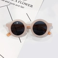 Detail view of round beige children's sunglasses with dark grey lenses and matte finish - Pink Frame Grey Lens