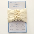Beige silk heatless curling headband by Robecurls attached to blue instruction card - Beige
