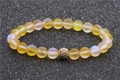 8mm yellow moonstone beads bracelet with a gold pavé crystal charm ball on gray background - Yellow