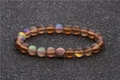 Mondstein-Perlenarmband mit roségoldener Zirkon-Kugel auf dunklem Hintergrund - Roségold 15 (Aurora-Effekt)