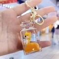Detailed view of Shiba Inu acrylic soda bottle keychain with orange liquid and star sequins - Keychain+Bottle Shape D1-1 / Square Bottle