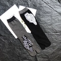 Detailed view of grey and black tabi socks featuring knitted owl patterns and ribbed cuffs - 35-41 / Owl