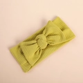 Macro detail of soft ribbed yellow baby headband with large elastic knit bow - Grass Green