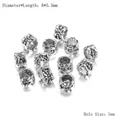 Vue macro des perles d'espacement rétro en alliage argenté 8x5,5mm avec trou de 5mm - Style 4-Motif Floral en Relief (AC0541) / Ensemble de 20 Pièces