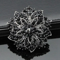 Luxury black crystal floral brooch featuring tiered petal design and silver alloy base - Black