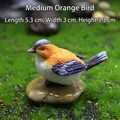 Miniature resin bird figurine in orange and blue-grey on pebble for garden decor - 5.3x3x3.3cm / Medium Orange Bird