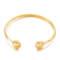 Brazalete abierto dorado con extremos esféricos en acero inoxidable pulido - Dorado
