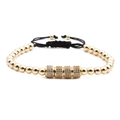 Adjustable black woven bracelet with gold plated cylinders inlaid with cubic zirconia - Gold Cylinder / Gold