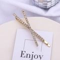 Élégantes barrettes en X dorées avec strass blancs scintillants pour femmes et filles - Doré