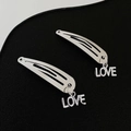 Silver metal hair clips featuring minimalist LOVE letter pendants in a cool edgy style - 10 Love (Pair)