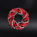 Elegant silver alloy wreath brooch with vibrant red rhinestones on a display stand - BR2393-5 Red