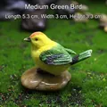 Miniature resin bird figurine in yellow and green perched on a pebble, 5.3x3x3.3cm - 5.3x3x3.3cm / Medium Green Bird