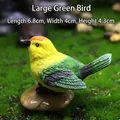 Resin bird figurine in green and yellow with realistic feather textures, 6.8cm long - Large Green Bird