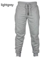 Détails du pantalon de jogging gris clair avec taille élastique à cordon et ourlets - Gris clair