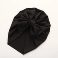 Detail shot of the large bow decoration on a soft black breathable baby turban hat - 21*17 cm / Black