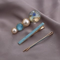 Three-piece hair clip set with blue cat-eye stone, golden planet charm, and pearls - Blue Starry Sky Duckbill Clip