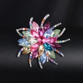 Elegant silver-toned flower brooch with colorful crystals on a black background - XD7938-6 Multicolor