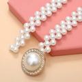 Detail of elegant double-strand pearl waist chain with rhinestone-encrusted gold buckle - Round