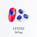 Macro detail of 9x7mm blue teardrop nail jewelry with heart-shaped silver alloy setting - Blue Waterdrop Heart (5763)