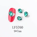 Close-up of 9x7mm emerald teardrop nail art charm with white rhinestones on a red nail - Emerald Waterdrop (5760)