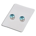 Sky blue crystal magnetic earrings with silver base on a white jewelry display card - Lake Blue