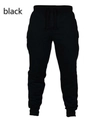 Pantalon de jogging noir avec cordon de serrage et chevilles côtelées sur fond blanc - Noir
