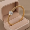 Golden woven mesh bracelet with a crystal-studded slide bead in a velvet jewelry box - 18K Gold