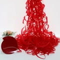 Red spiral hanging decorations showing both compact disc form and wavy hanging effect - Red