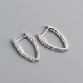 Detailed shot of S925 sterling silver V-shaped hoop earrings with inlaid zircons - 925 Silver / White Gold (Pair)