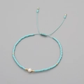 Handmade sky blue beaded bracelet with white natural pearl and adjustable gold cord - Sky Blue