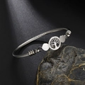 Zilveren roestvrijstalen kabelarmband met levensboombedel en praktische haaksluiting - Levensboom / Staalkleur