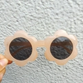 Cute pink flower-shaped sunglasses for kids with round dark lenses for outdoor play - Champagne