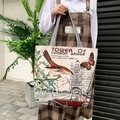 Retro canvas tote bag featuring Tower Bridge print and striped handle on model - London Tower Bridge