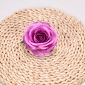 Artificial silk rose head with purple gradient petals on a woven straw mat base - Light Purple