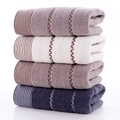 Lot de quatre serviettes épaisses en coton gris, blanc et marron avec motifs ondulés - Assortiment multicolore