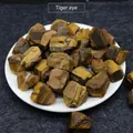 Natural tiger eye raw stone chips with distinctive yellow and brown fibrous banding texture - Tiger's Eye